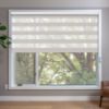 Beige blackout zebra blinds in window